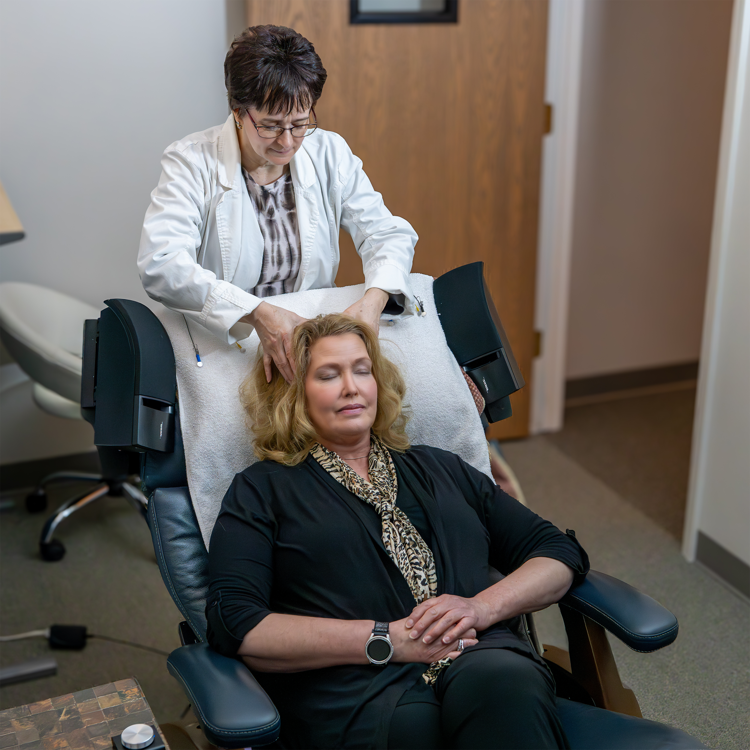 A client having read-only EEG sensors placed before a neurofeedback session